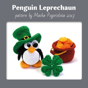 May include: A crocheted penguin wearing a green leprechaun hat, holding a pot of gold. The penguin is standing on a white surface with a green four-leaf clover.