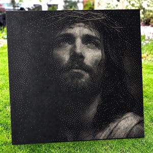 May include: A square black panel featuring a stippled portrait of a person with long hair and a crown of thorns. The image is created using thousands of tiny white dots that vary in density to form the facial features, shadows, and highlights.