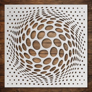 May include: A square white stencil featuring a repeating pattern of circular cutouts that vary in size and spacing to create a three-dimensional optical illusion effect. The design consists of larger, distorted circles in the centre.