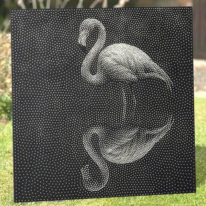May include: A square black panel featuring a pointillist design created with white dots. The pattern depicts the silhouette of a flamingo with its head curved downward, formed by varying densities of white dots against the solid black background.