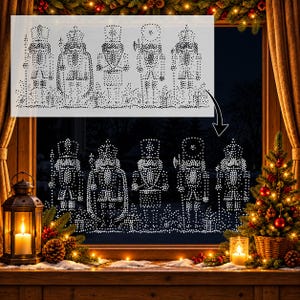 May include: A white stencil sheet featuring five distinct nutcracker figures arranged in a row, composed of small dots. The stencil is shown positioned against a window, displaying the same nutcracker designs as white dot patterns on the glass.