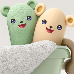 May include: Two plush toy bears with smiling faces are sitting in a green bathtub. The bear on the left is green and the bear on the right is yellow. Both bears have blue eyes and are wearing white towels.