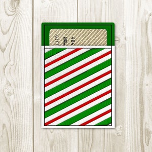 May include: A red and green striped gift card holder with a white border. The holder has a gift card inside with the word "GIFT" visible.