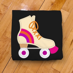May include: A white roller skate with orange laces and a pink, orange, and purple stripe design on the side. The skate has white wheels with purple centers.