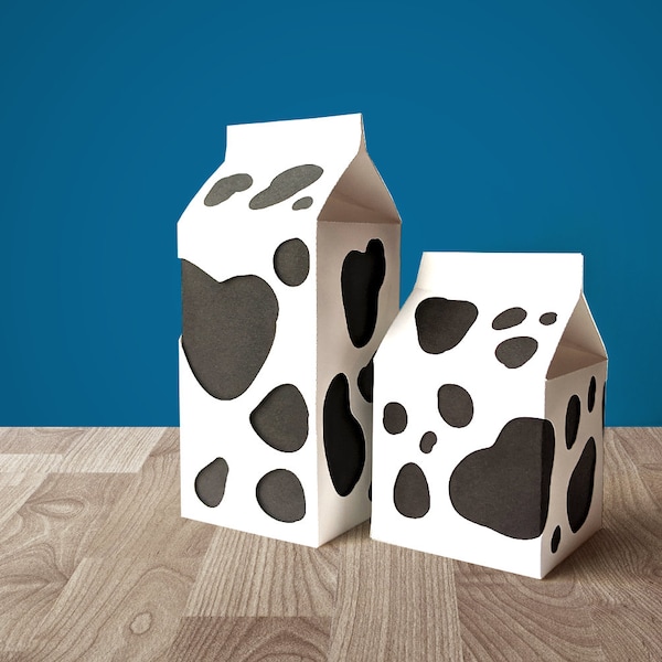 Boîtes en carton de lait avec des découpes de taches de vache SVG Design