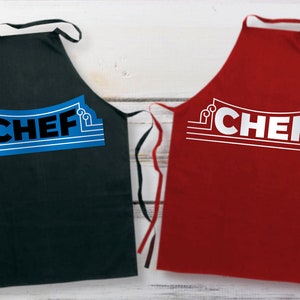 May include: Two aprons with the word "CHEF" printed on them. One apron is black with blue text and the other is red with white text.