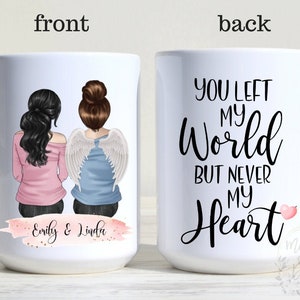 Puede incluir: Taza de cer&aacute;mica blanca con un dise&ntilde;o de dos figuras, una con alas de &aacute;ngel, y el texto "You Left My World But Never My Heart." La parte delantera de la taza tiene los nombres "Emily & Linda."