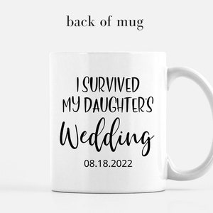 May include: White ceramic mug with black text that reads "I survived my daughter's wedding 08.18.2022".