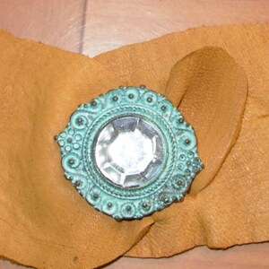 One of a kind uniquely designed leather bracelets, easily adjusted for fit.   Large inventory all unique in design and color, just ask.
