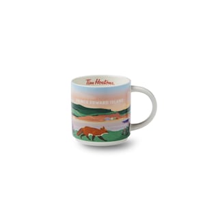 May include: A white ceramic mug with a landscape design featuring a fox, green hills, and the text "Prince Edward Island." The mug has a grey handle and the Tim Hortons logo.