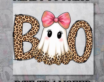May include: A DTF transfer design featuring the text READY TO PRESS and DTF TRANSFER. The central graphic shows a white ghost with a pink glittery bow, long eyelashes, and pink cheeks, positioned between two letters B and O with a leopard print pattern.