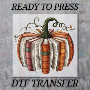May include: A DTF transfer featuring a pumpkin made of open books. The books are orange and red, with green and brown accents. The text "READY TO PRESS" and "DTF TRANSFER" are at the top and bottom of the image.