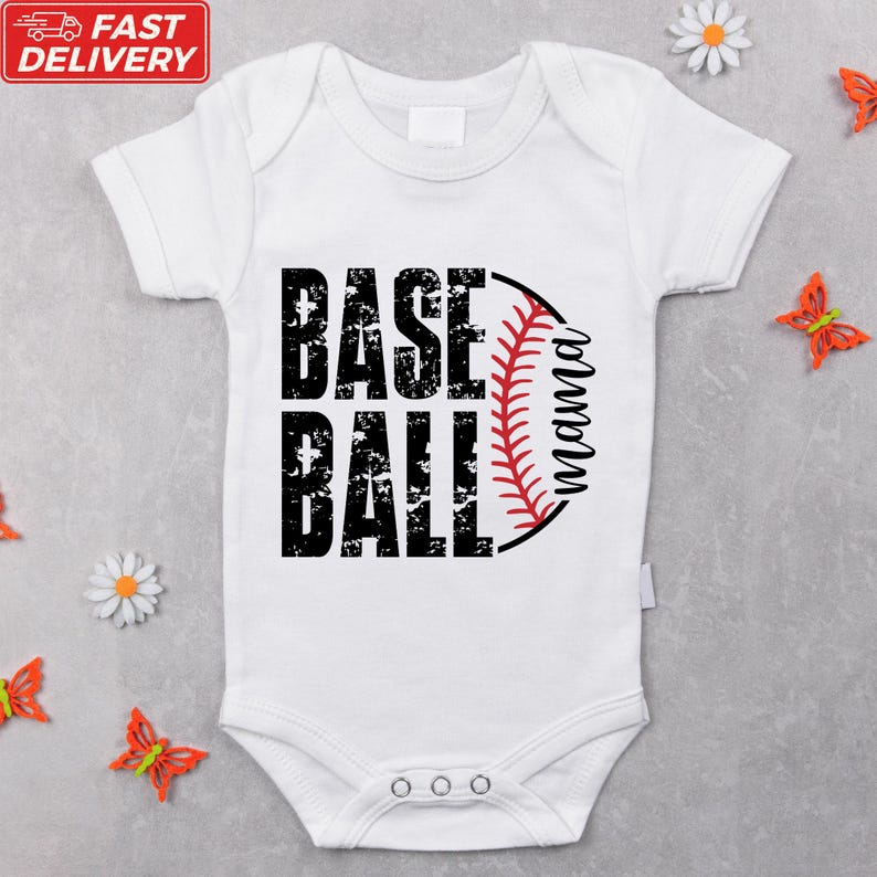 A white baby onesie with the text "BASE BALL" printed on it, surrounded by small orange flowers.