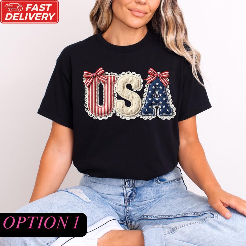 A woman wearing a black t-shirt with the word "USA" printed on it, along with red and white bows.