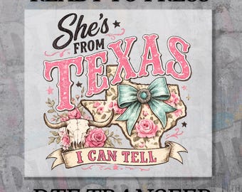 May include: A DTF transfer print featuring the text 'READY TO PRESS' at the top and 'DTF TRANSFER' at the bottom. The central graphic displays the words 'She's FROM TEXAS I CAN TELL' with a cow skull, pink roses, and a large teal bow on a map.