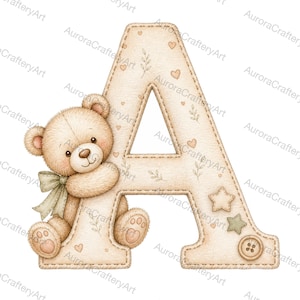 May include: A beige letter A featuring a stitched border, decorated with small hearts, leaves, and a star. A light brown teddy bear with a sage green bow sits against the left side of the letter, which also includes a small button detail.