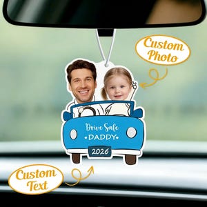 May include: A personalized car air freshener featuring a smiling man and a young girl. The blue car-shaped design includes the text "Drive Safe DADDY" and the year "2026". The words "Custom Photo" and "Custom Text" are also visible.