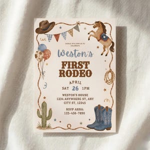 May include: A beige invitation card with a rodeo theme. It features a cowboy hat, a rearing horse, balloons, and a pair of blue cowboy boots. The text reads "Weston's First Rodeo" with event details. The card is decorated with stars and rope.