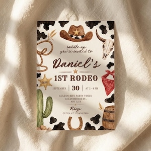 May include: A rectangular invitation card featuring a watercolor western theme with black cow print patterns. Illustrations include a brown cowboy hat, a steer skull, a lasso, a sheriff badge, a cactus, a red bandana, and a wooden barrel.