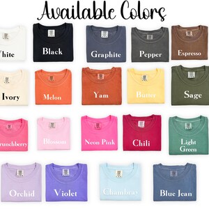 a collection of colorful t-shirts, each with a different color and design, arranged in a grid-like pattern.