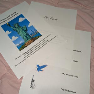 May include: Educational sheets featuring the Statue of Liberty with text stating it is a gift from France, located in New York, and holds a tablet dated July 4, 1776. Additional text lists The Statue of Liberty, The Eagle, The American Flag, and The White House.