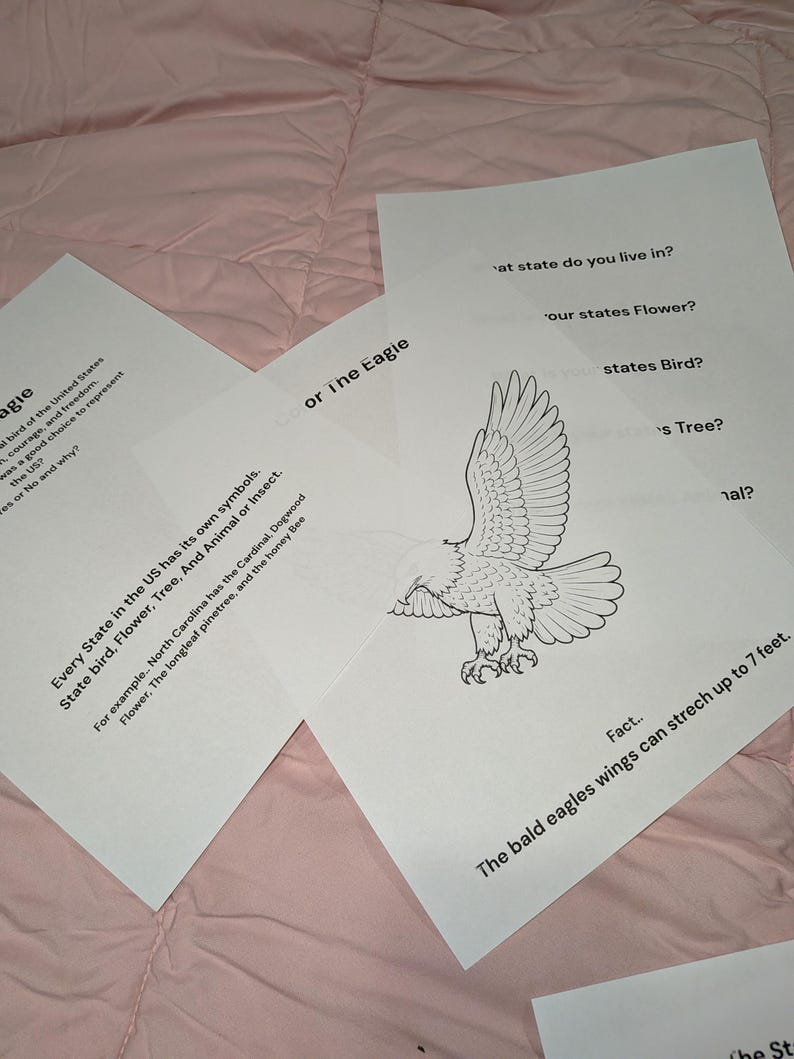 May include: Three white sheets of paper with black printed text and a line drawing of a bald eagle. The text includes questions about state symbols, facts about the bald eagle, and mentions that bald eagle wings can stretch up to 7 feet.