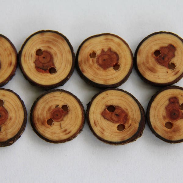 8 small mystery wood buttons - just under an inch