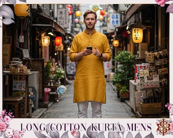 May include: A man in a mustard yellow long cotton kurta and white trousers, holding a phone. The scene is a street with shops and lanterns. The text at the bottom says "LONG COTTON KURTA MENS".