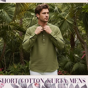 May include: Olive green short cotton kurta with a mandarin collar and button-down front. The long-sleeved shirt is worn by a person standing in front of a lush green background. The text "SHORT COTTON KURTA MENS" is at the bottom of the image.