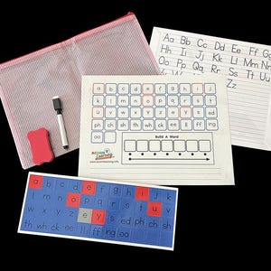 May include: Educational resources including alphabet cards, a handwriting practice sheet, and a word-building card are displayed. A pink mesh pouch, a red eraser, and a black marker are also visible.