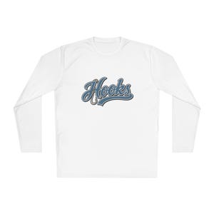 May include: A white long-sleeve shirt featuring a graphic on the chest with the word Hooks written in a blue cursive font with a dark outline. The letter H is stylized to incorporate a fishing hook shape into its design on a plain white background.