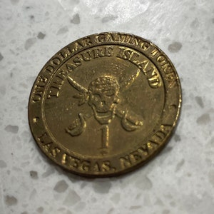 Treasure Island one dollar gaming (1) token Las Vegas Nevada preowned condition original patina unknown metal