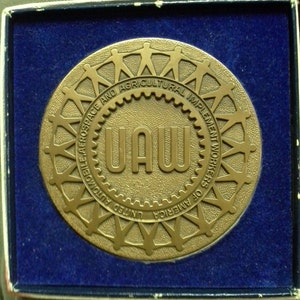 United automobile aerospace and agricultural implement workers of America medal Roger C Weirick metal arts company rochester new york brass