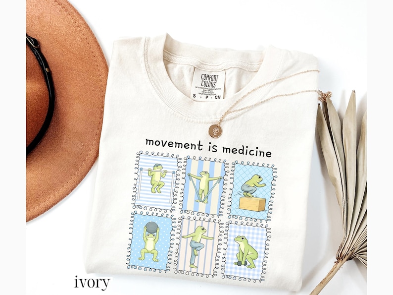 green frogs doing therapy exercises on a Comfort Colors® t-shirt with “movement is medicine” text with stamps design, printed on soft cotton shirt in various earthy tones