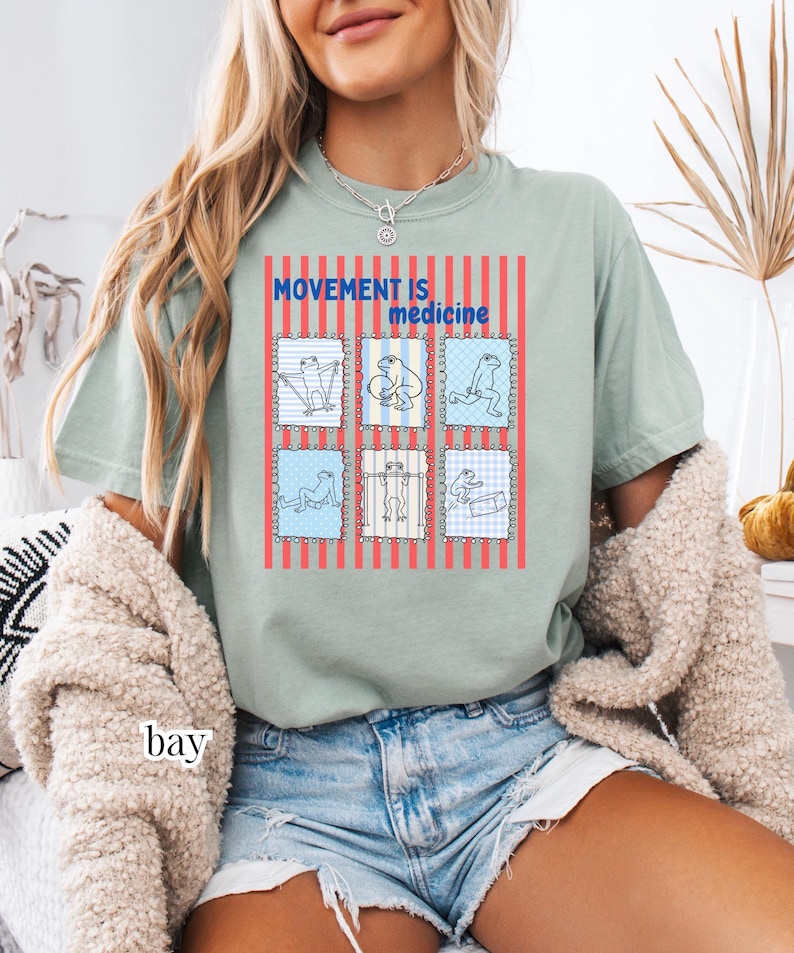 frogs doing therapy exercises on a Comfort Colors® t-shirt with “movement is medicine” text with stamps and lines in background design, printed on soft cotton shirt in various earthy tones