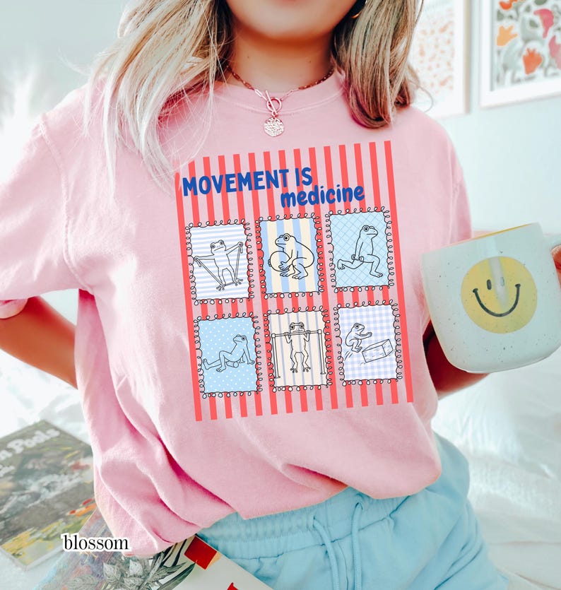 frogs doing therapy exercises on a Comfort Colors® t-shirt with “movement is medicine” text with stamps and lines in background design, printed on soft cotton shirt in various earthy tones