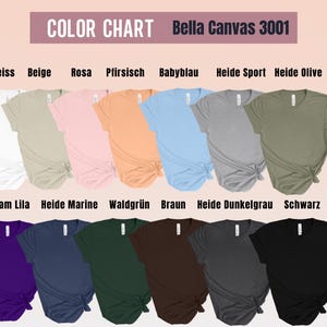 May include: A color chart displays a variety of Bella Canvas 3001 t-shirts in various colors. The colors include white, beige, pink, peach, light blue, gray, olive green, purple, navy, dark green, brown, dark gray, and black.