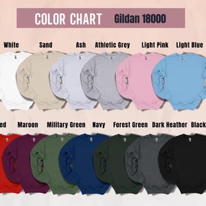 May include: A color chart of Gildan 18000 sweatshirts in various colors, including white, sand, ash, athletic grey, light pink, light blue, red, maroon, military green, navy, forest green, dark heather, and black. The text "COLOR CHART" is at the top.