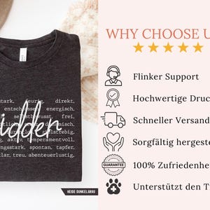 May include: Dark gray t-shirt with the word "widder" in a cursive font, surrounded by descriptive words in a typewriter font. The shirt is folded and displayed on a white surface.