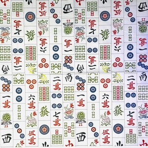 May include: A background of white Mahjong tiles with a repeating pattern. Each tile displays Chinese characters, symbols, and colourful designs in red, green, blue, and yellow. The tiles are arranged in a grid, creating a detailed and complex surface.
