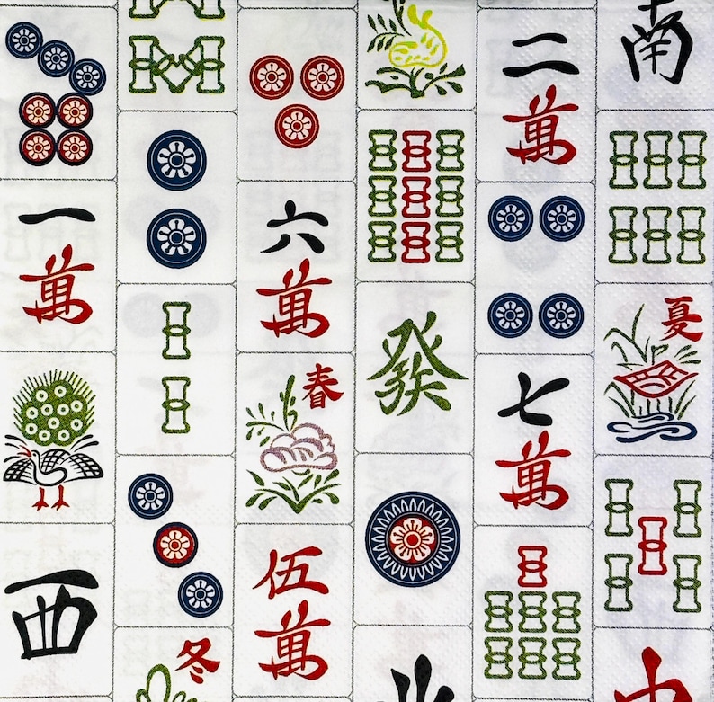 May include: A close-up of a white surface covered in Mahjong tiles. The tiles feature various symbols, characters, and colourful designs in red, green, blue, and black. The image showcases a variety of tile types, including characters and suit symbols.