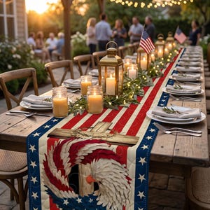 May include: A patriotic table runner with a red, white, and blue design featuring an eagle and stars. The runner is placed on a wooden table set for a gathering, with candles and lanterns adding to the ambiance. The scene is set outdoors.