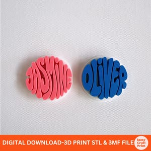 May include: Two circular 3D printed name tags featuring raised lettering. The left tag is pink with the name JASMINE, and the right tag is blue with the name OLIVER. The text at the bottom reads DIGITAL DOWNLOAD-3D PRINT STL & 3MF FILE.