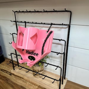 May include: A set of three ceramic mugs with a speckled, matte finish. The mugs are in shades of cream, gray, and black. Each mug has a simple, minimalist design, perfect for coffee or tea.