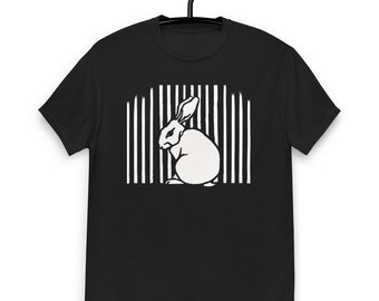 May include: Black t-shirt with a white graphic of a rabbit sitting behind bars.