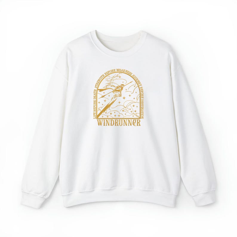 May include: White sweatshirt with a gold graphic. The graphic features a stylized figure with the text "WINDRUNNER" at the bottom. The design includes the phrases "LIFE BEFORE DEATH", "STRENGTH BEFORE WEAKNESS", and "JOURNEY BEFORE DESTINATION".