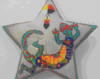 May include: A star-shaped beaded pillow with a colorful beaded lizard design. The lizard is curled up in a circle with its tail wrapped around its body. The star is white with a turquoise border.