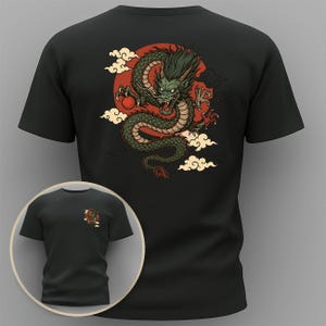 May include: Black t-shirt with a green dragon design on the back, set against a red sun and white clouds. The dragon has red accents. A smaller version of the design is on the front of the shirt.