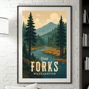 May include: Framed art print featuring a scenic landscape with a river winding through a forest. The artwork includes tall evergreen trees, a mountain range, and the text "Visit Forks Washington" in a vintage style.