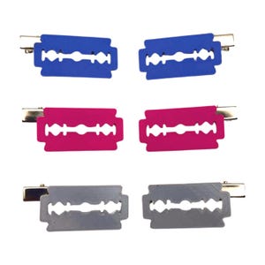 May include: Six hair clips in the shape of razor blades. Two are blue, two are pink, and two are gray. Each clip has a silver metal clasp.